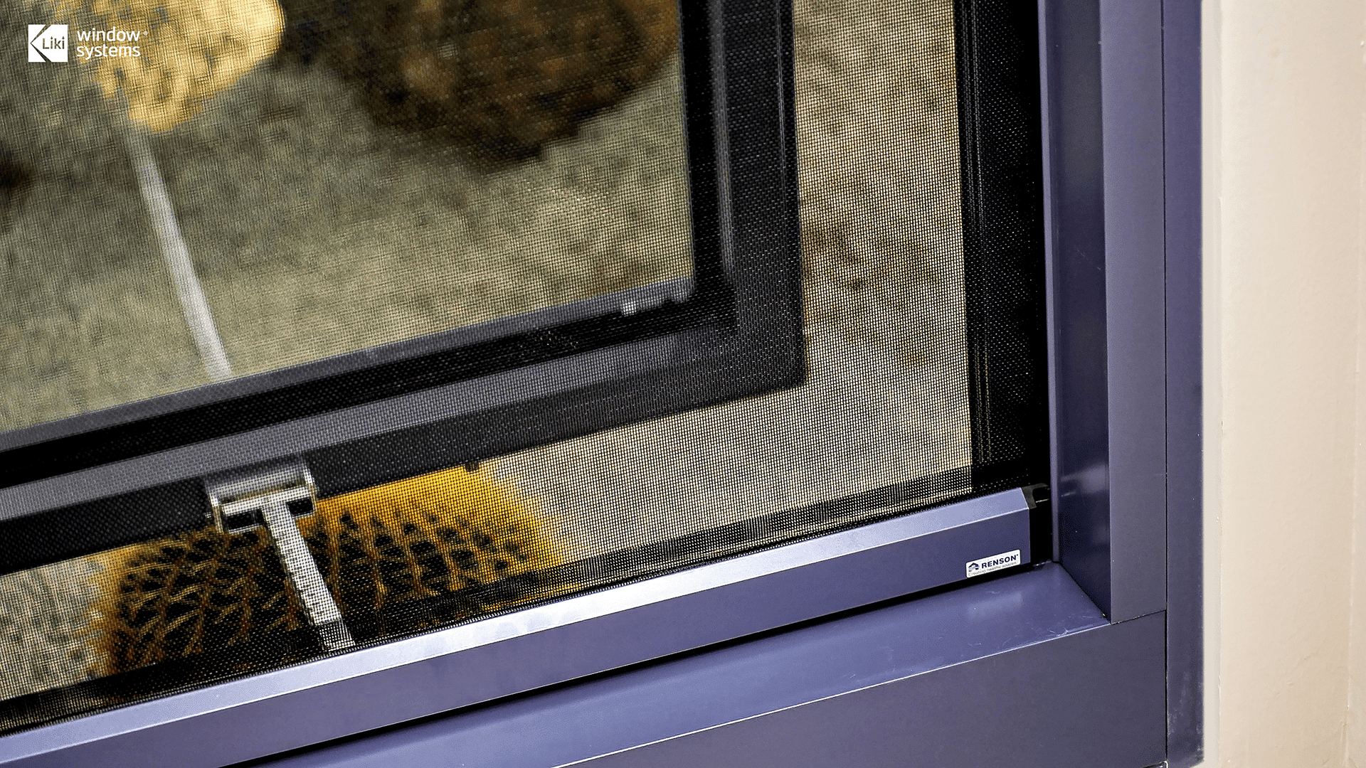 Detail shot of LIKI aluminum window system featuring genuine Renson ventilation screen mesh with visible brand logo, ensuring insect protection and airflow.