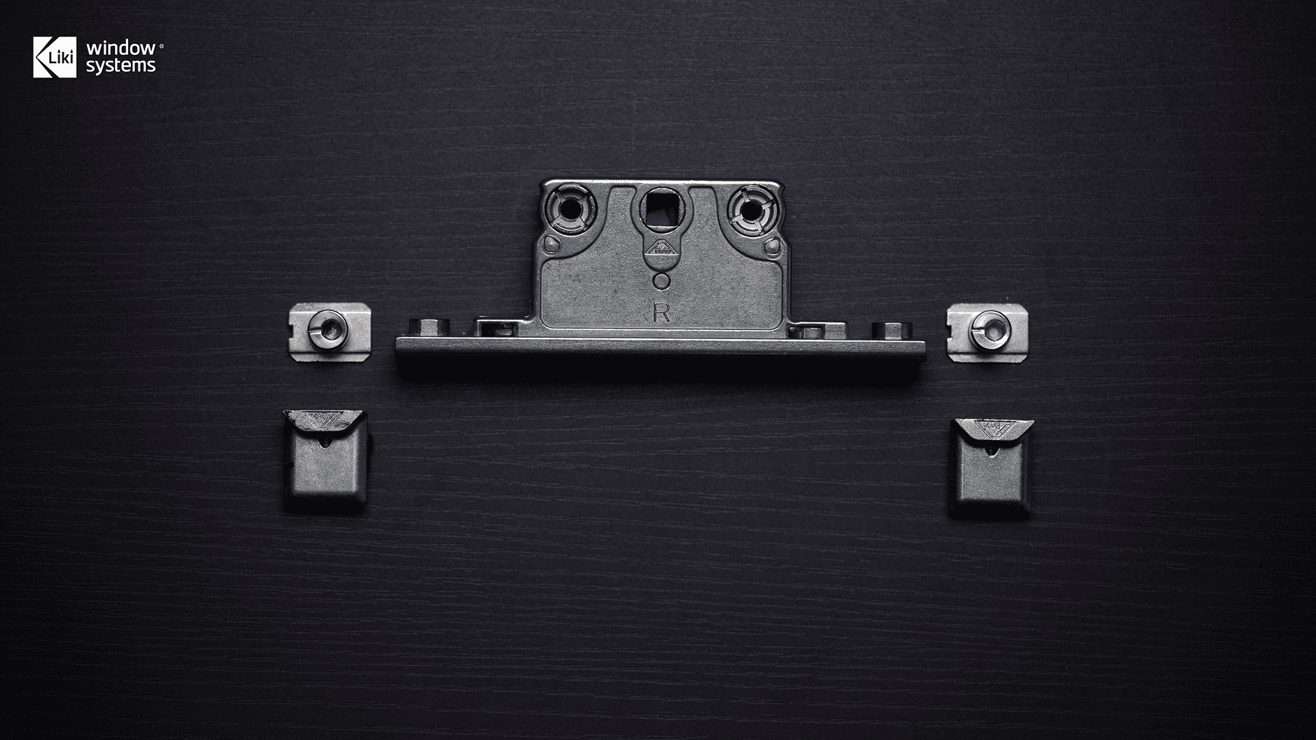 Studio detail shot of genuine Roto window hardware components, including heavy-duty mounting brackets and locking cams, demonstrating the German engineering core of LIKI systems.